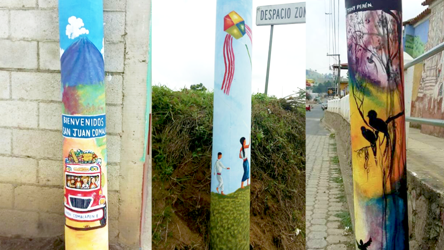 Guatemaltecos pintan postes en San Juan Comalapa, Chimaltenango