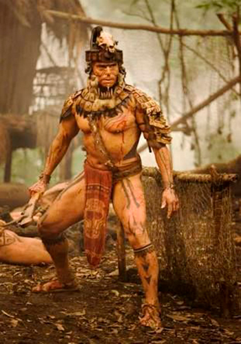 Descripción de foto - Hombre vesito de guerrero maya en combate. - Crédito de foto - Matador Network
